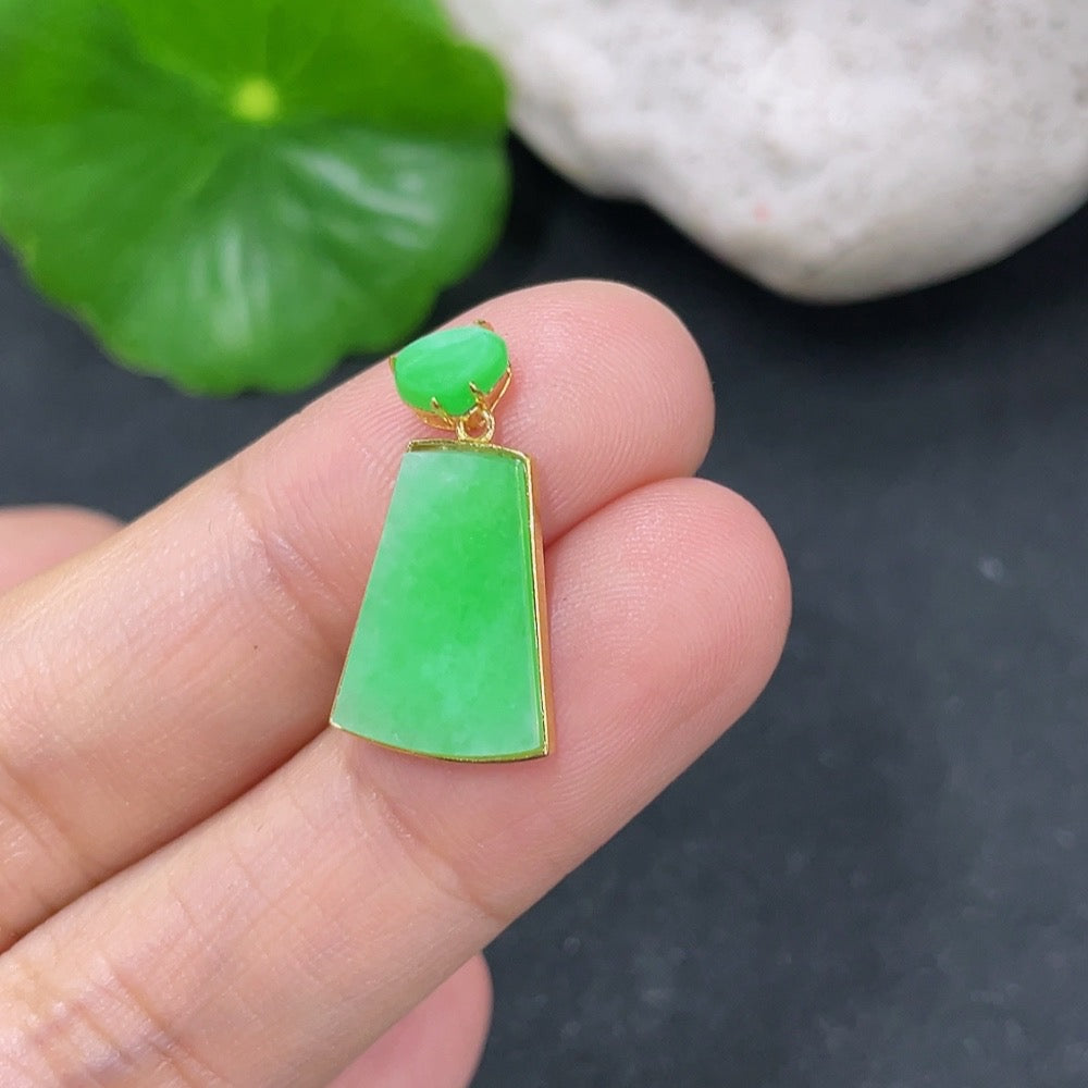 Jadeite plain pendant with 18k gold setting, weighing approximately 1.56g, featuring a smooth, polished jade gemstone.