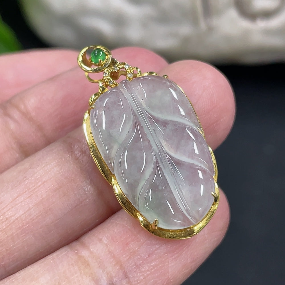 Jadeite leaf pendant with 18k gold inlay and diamond accents, weight 2.17g, featuring detailed jade craftsmanship.