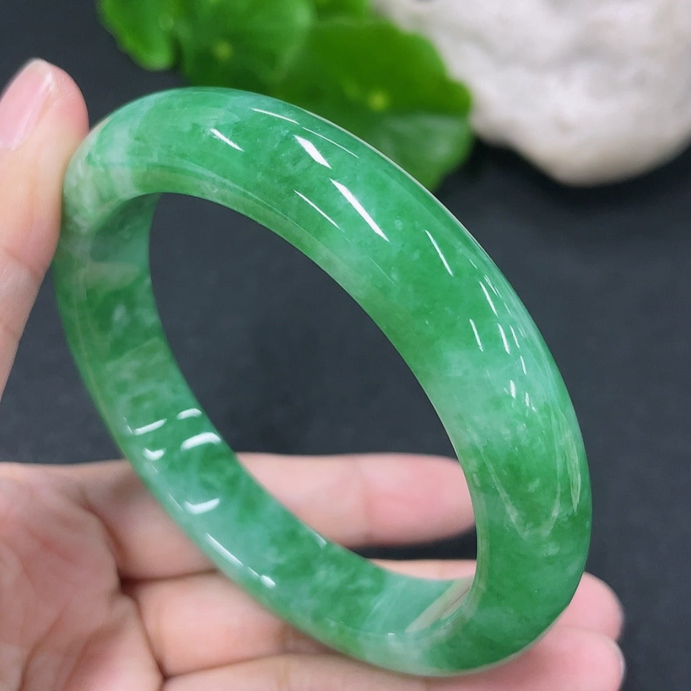 HKHQ jadeite round bangle in size 56.5mm, showcasing smooth, polished green jade with a total weight of 56.9g.