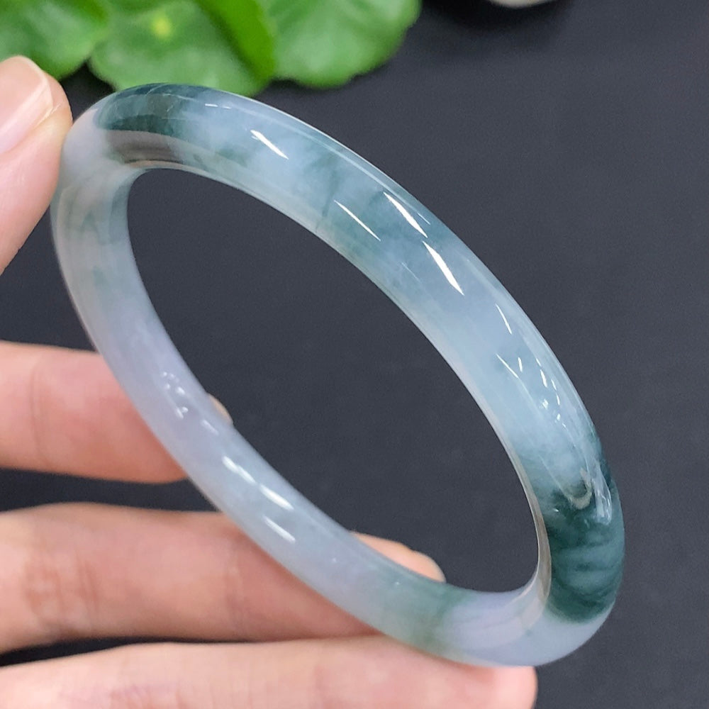 HKHQ jadeite round bangle, 57mm size, weighing approx. 32.5g, smooth green jade jewelry bracelet with polished finish.