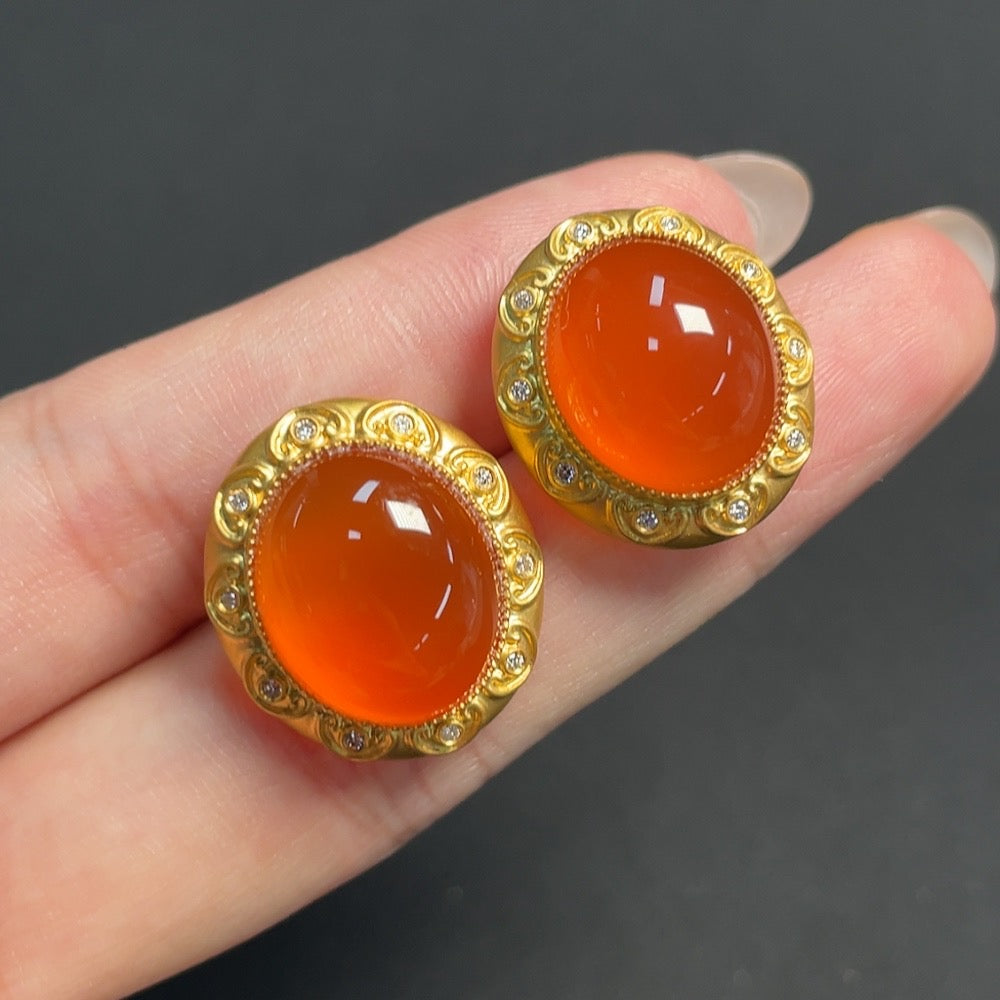 South Red Agate gemstone earrings by HKHQ with 18K gold and diamond accents, featuring organic material and non-gold ear stoppers.