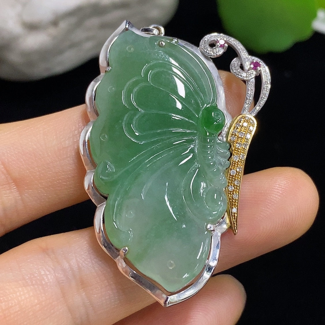 Jadeite butterfly inlay pendant with 18k gold accents and diamond details, showcasing a delicate butterfly design on smooth jade.