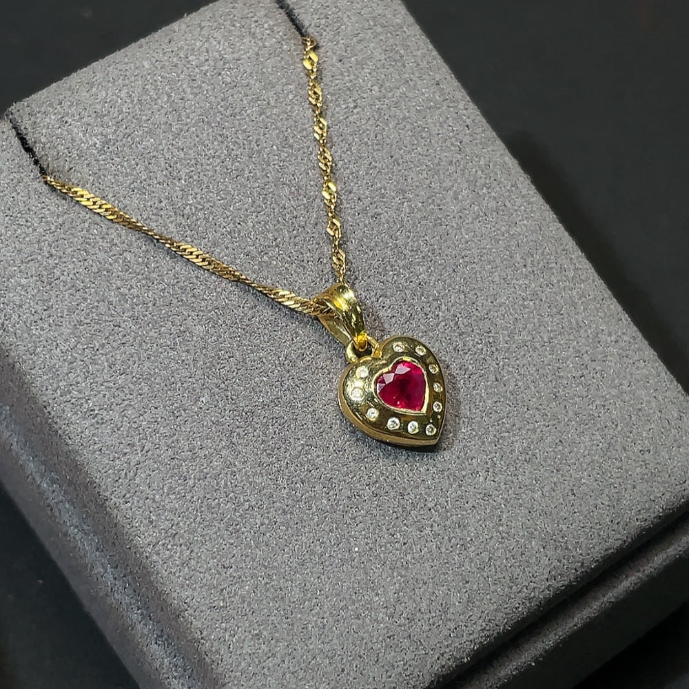 18K gold ruby pendant with diamond accents, total weight including chain approximately 4.14g