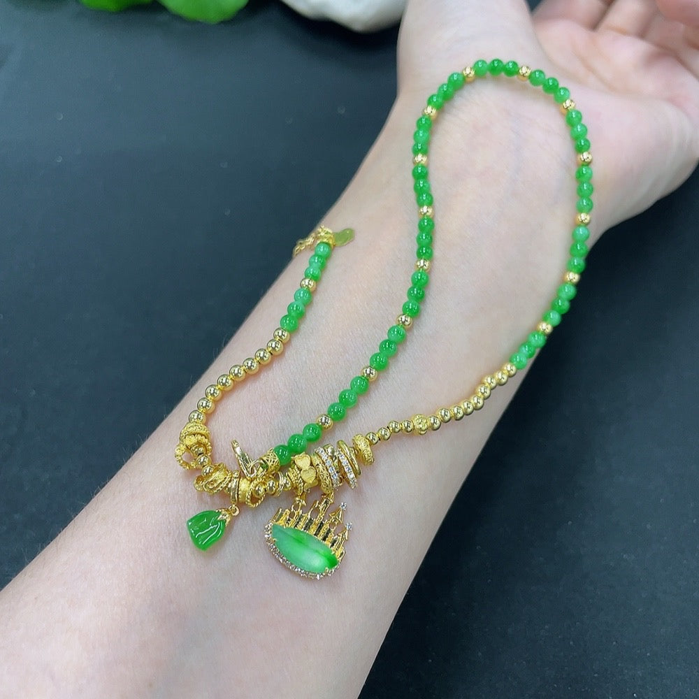 Jadeite pendant with 18K gold and diamond accents, featuring a polished green jade stone on a sleek chain.