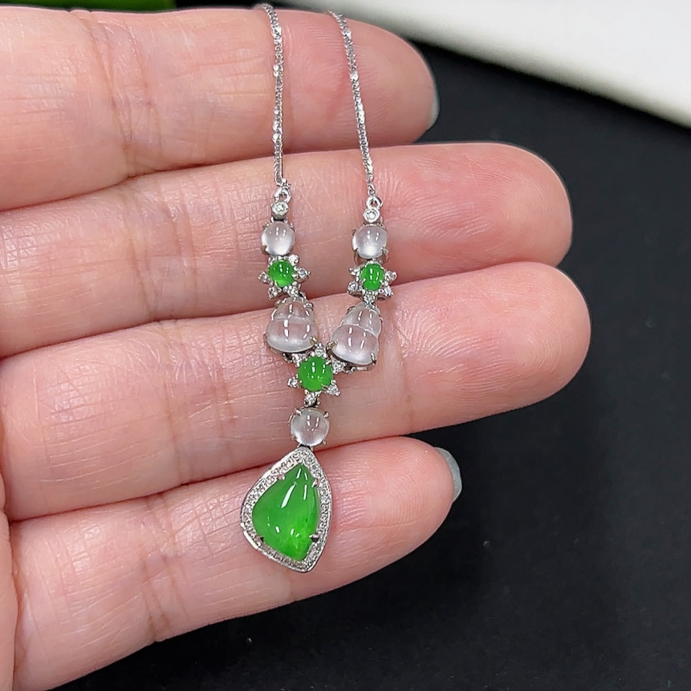Elegant jadeite necklace with diamond accents in 18K gold, featuring a delicate, polished jade pendant and fine craftsmanship.