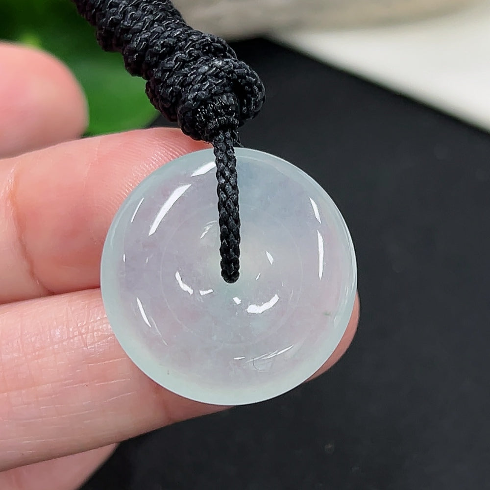 Jadeite Peace Knot pendant with rope, crafted from green jade, weighs approximately 7.1g, showcasing intricate design and smooth surface.