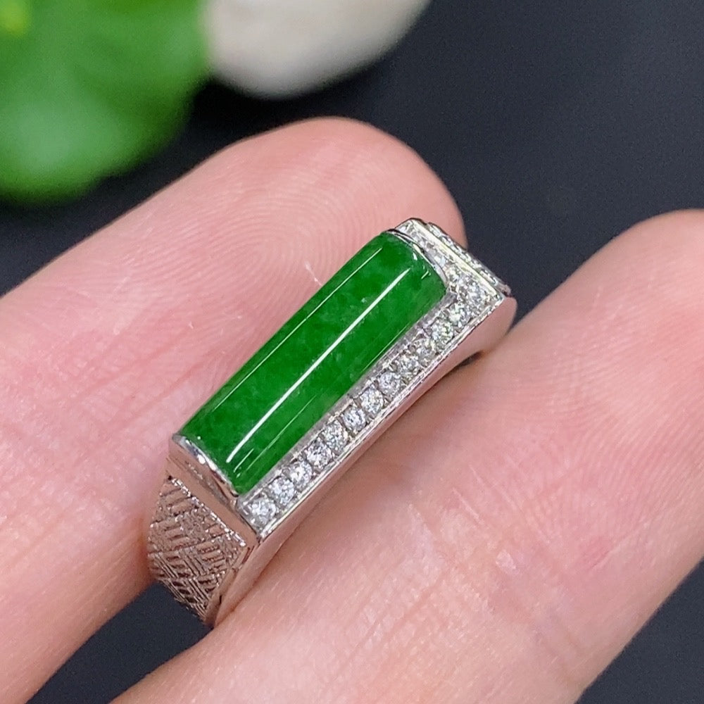 Jadeite cabochon ring in 14K gold with diamond accents, elegant jewelry piece featuring a smooth green gemstone and sparkling details.