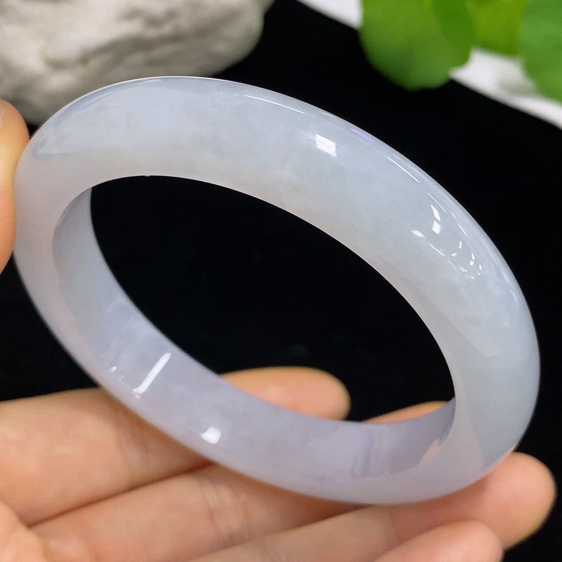 Jadeite round bangle in size 58.8, crafted from green jade, weighing approximately 64.88g, with a smooth polished surface.