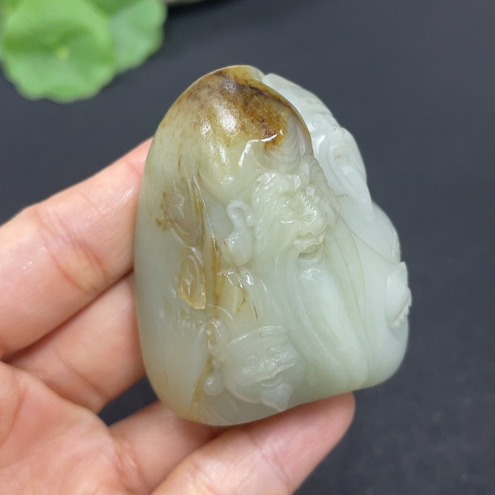 Hetian jade pendant by HKHQ featuring intricate carvings symbolizing fortune, prosperity, and longevity, weighs approximately 100.5g.