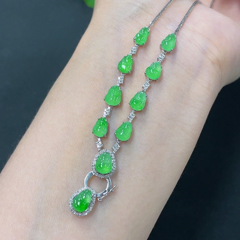 Jadeite inlaid gourd necklace with 18k gold and diamond accents, featuring a jade pendant on a chain, weighing approximately 6.28g.