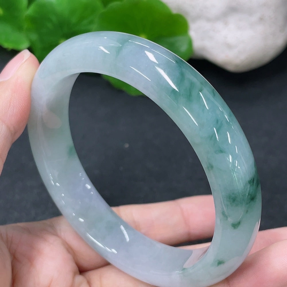 Jadeite round bangle in size 54.7mm, weighing approximately 52.26g, featuring smooth green jadeite with polished finish.