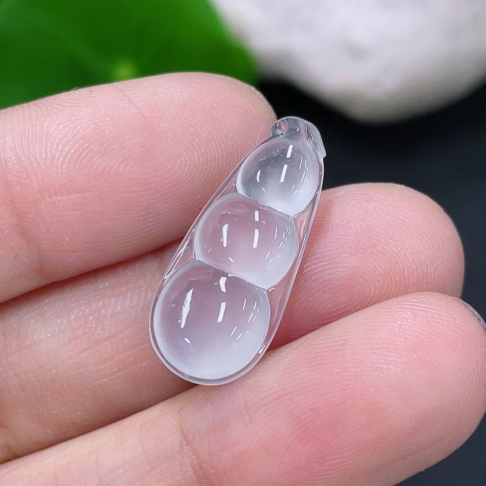 Jadeite inlaid piece featuring a fortunate bean design, weighing approximately 1.35g, by HKHQ, showcasing intricate jade craftsmanship.