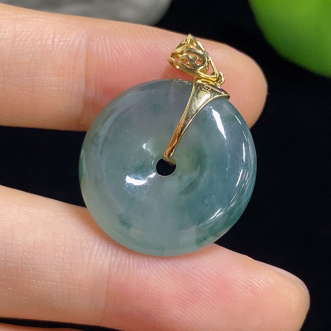 Jadeite Peace Knot pendant in 18k gold with diamond inlay, weighing approximately 5.82g, featuring intricate craftsmanship.