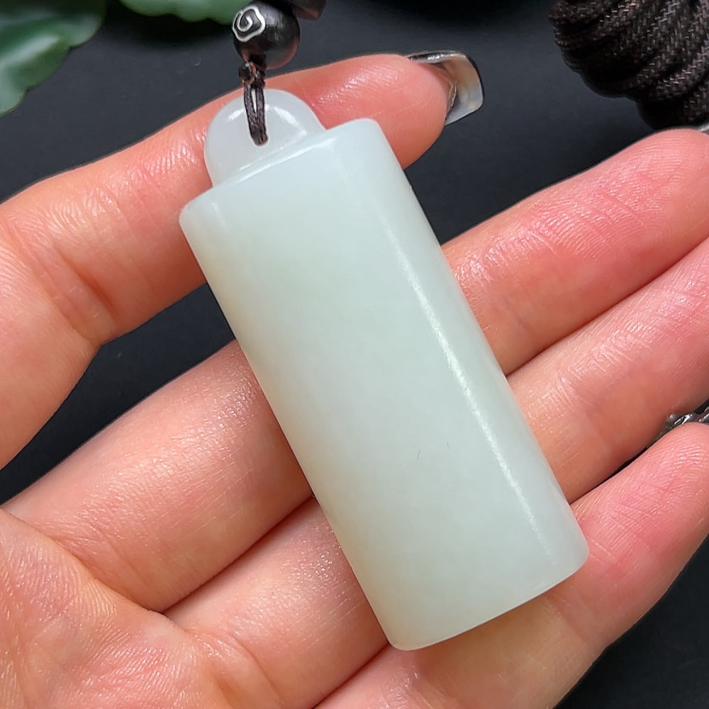 Hetian Jade bamboo tube pendant necklace with rope, weighing approximately 38.6g, featuring a polished green jade pendant and cord.