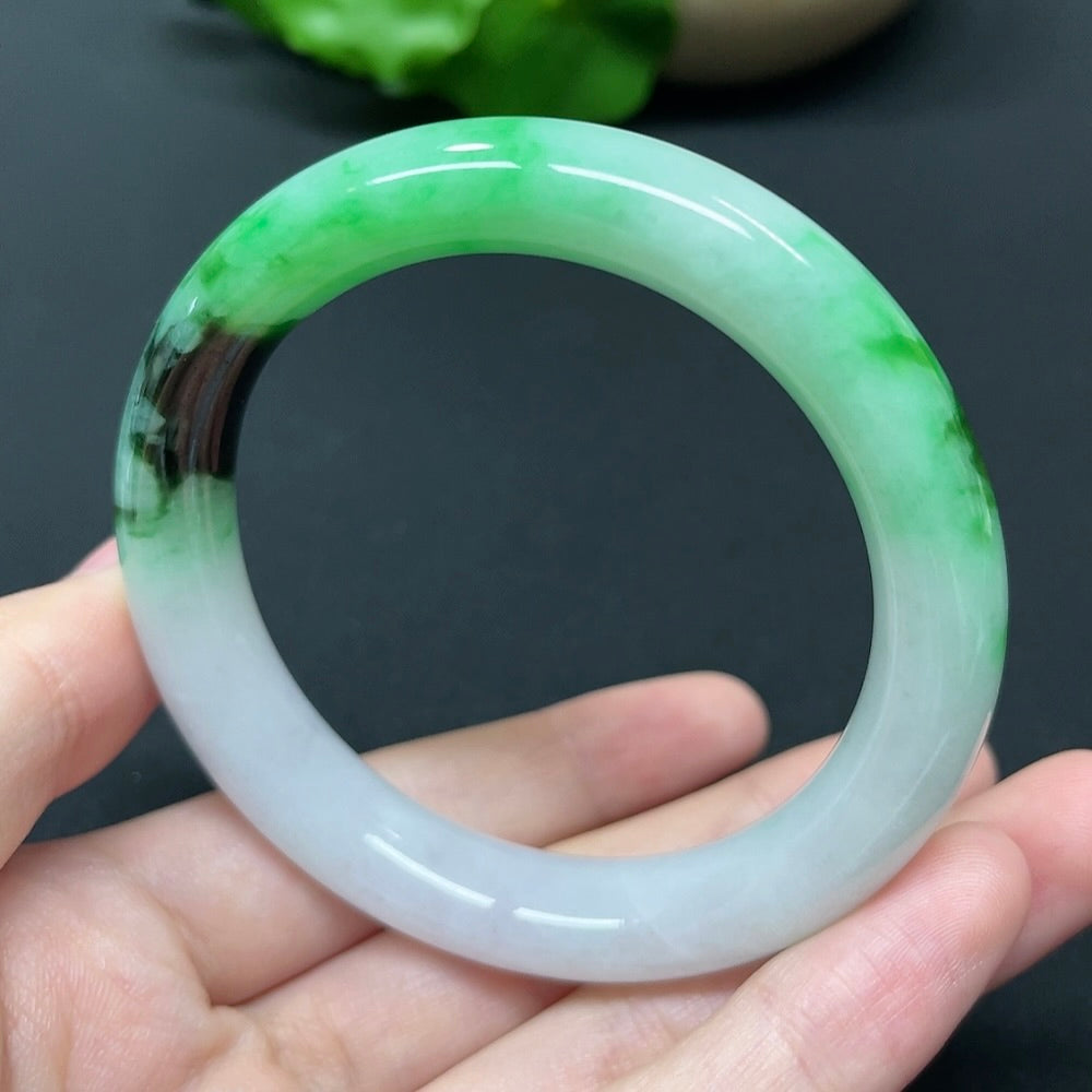 HKHQ jadeite round bangle in size 52.5 with a weight of 51.35g, showcasing smooth, polished jadeite surface and elegant craftsmanship.