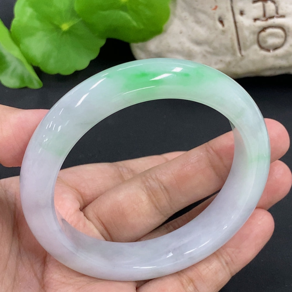 HKHQ jadeite round bangle, size 57.1, weighing 64.6g, showcasing smooth, polished jadeite with vibrant green color.