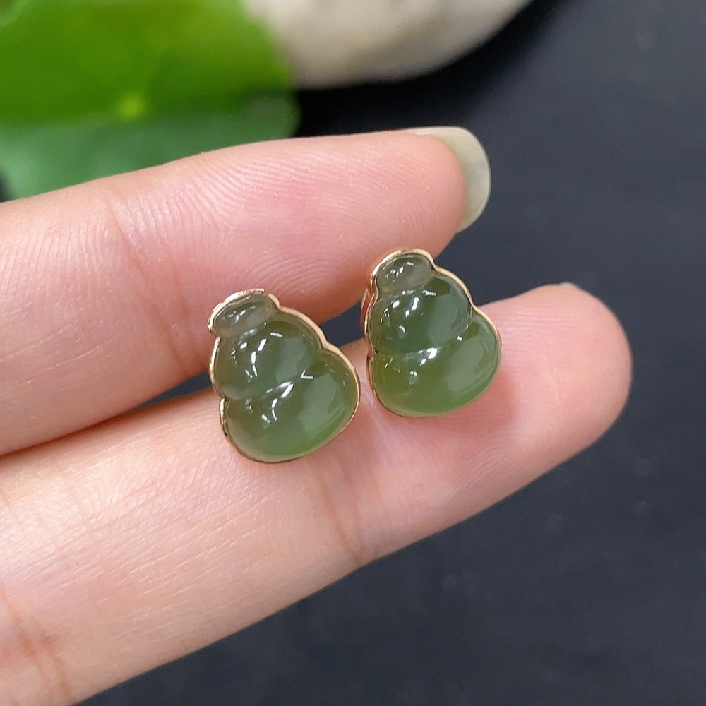 Hetian jade inlaid earrings with 18k gold settings, HKHQ brand, showing detailed jade and gold craftsmanship.