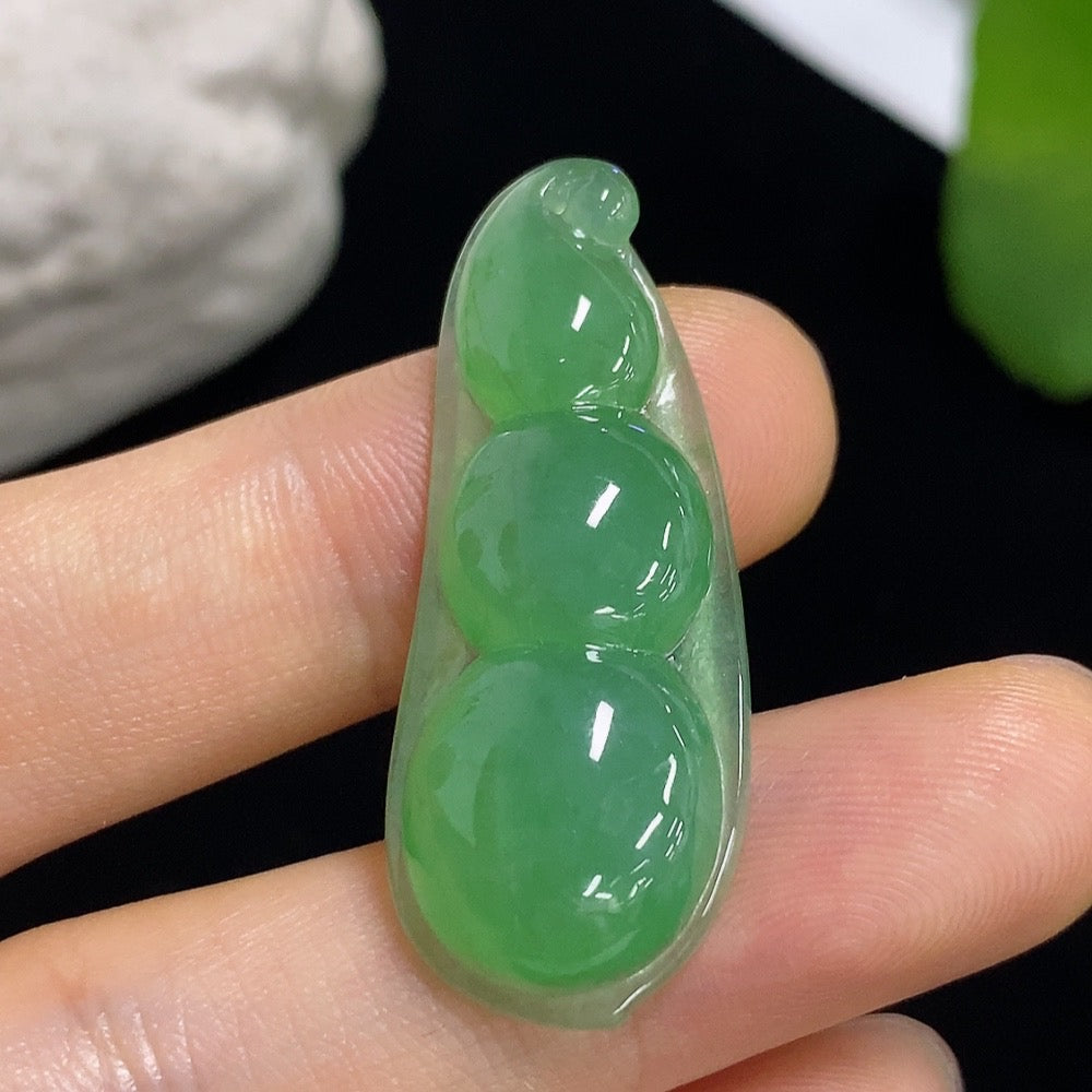Jadeite lucky bean pendant from HKHQ, crafted from green jade, weighs approximately 5.27 grams, featuring a smooth, polished surface.