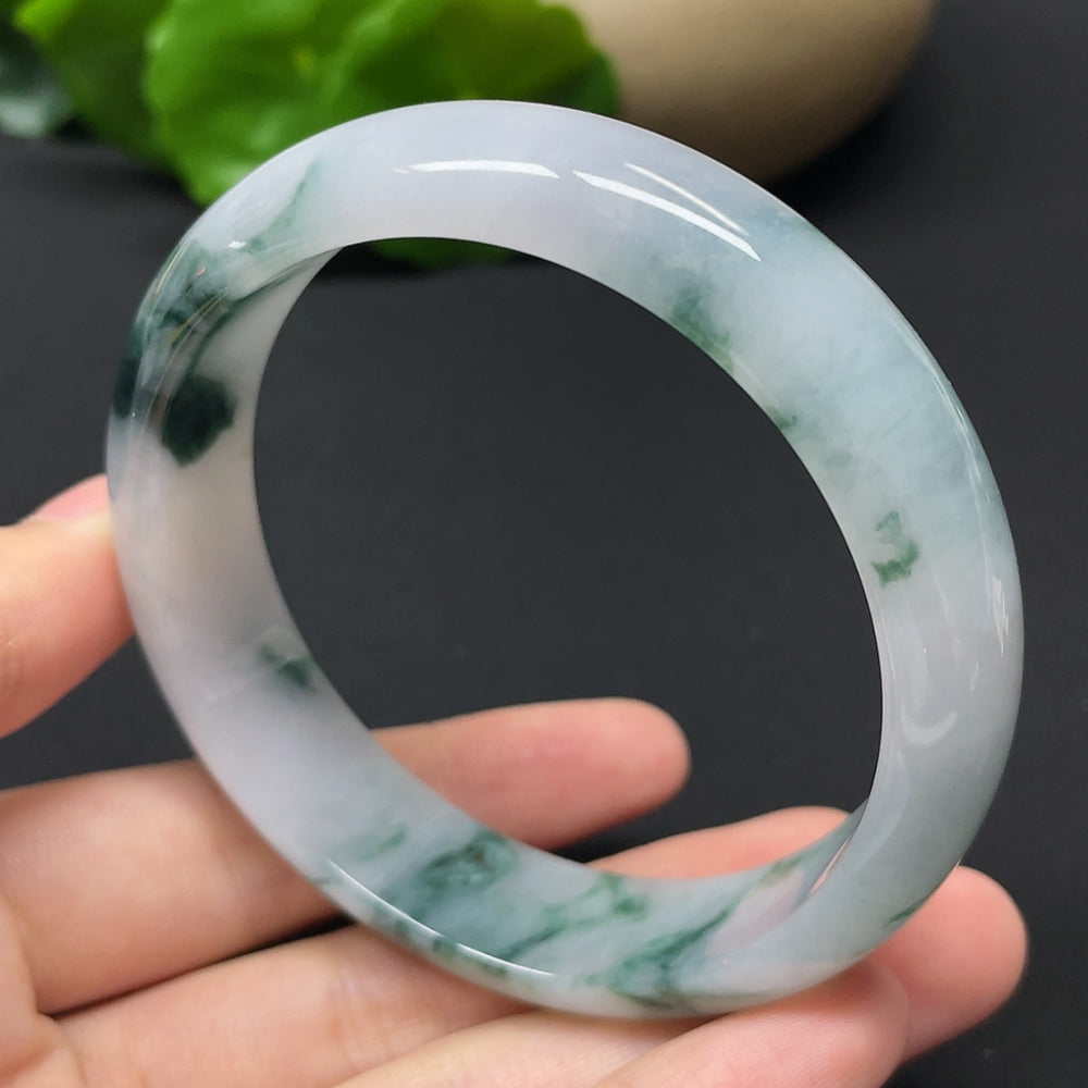 HKHQ jadeite round bangle with mineral components, weighing 54.31g, size 57.9, showcasing smooth, polished surface and natural stone details.