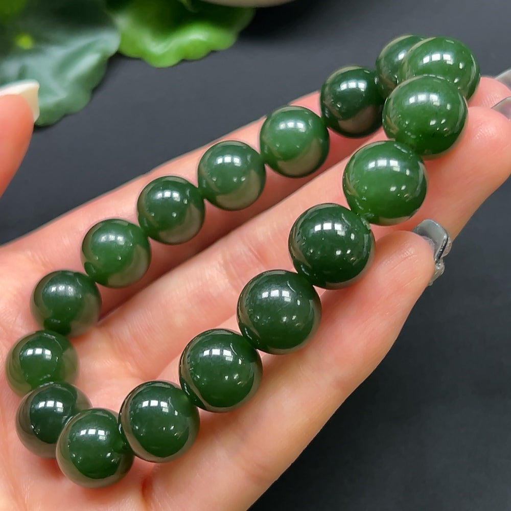 HKHQ Hetian Jade bracelet with 12mm beads, weighing approximately 44.19g, featuring smooth, polished green jade stones.