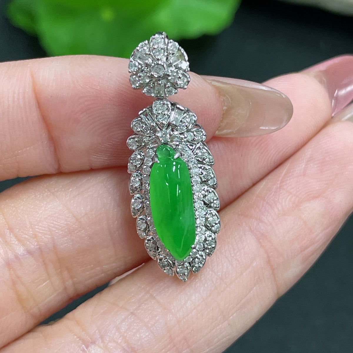 Jadeite melon drop pendant with 18K gold accents and diamond details, featuring a polished green jade gemstone.