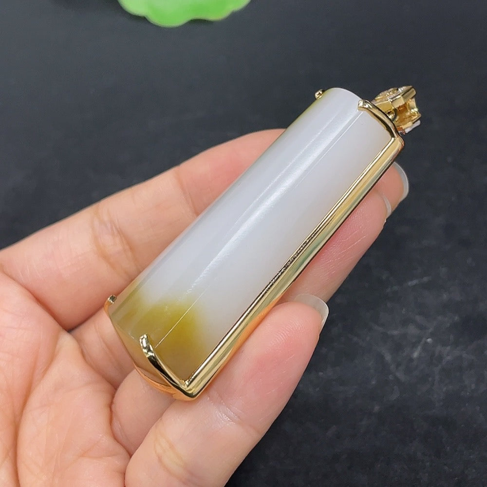 Hetian jade inlaid plain pendant with 18k gold setting, non-diamond, featuring smooth jade surface and gold accents.