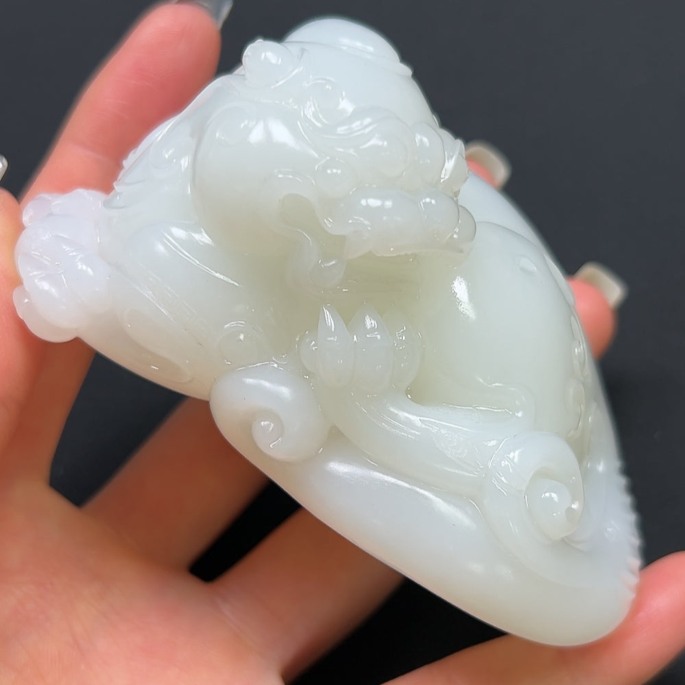 Hetian Jade Pi Xiu hand piece from HKHQ, featuring intricate carved jade design, weighing approximately 296.22g.