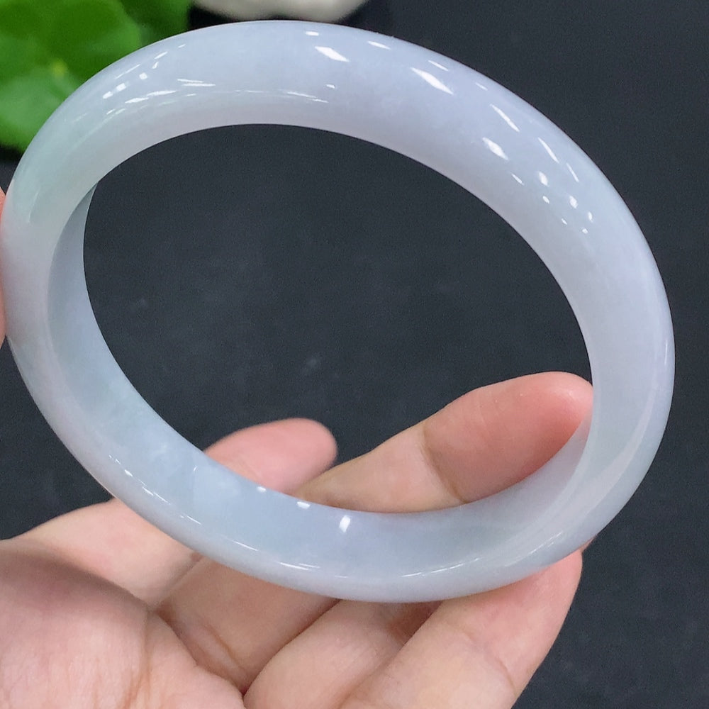 Huiliu certified jadeite round bracelet by HKHQ featuring smooth, polished green jade beads on a stretchy cord.