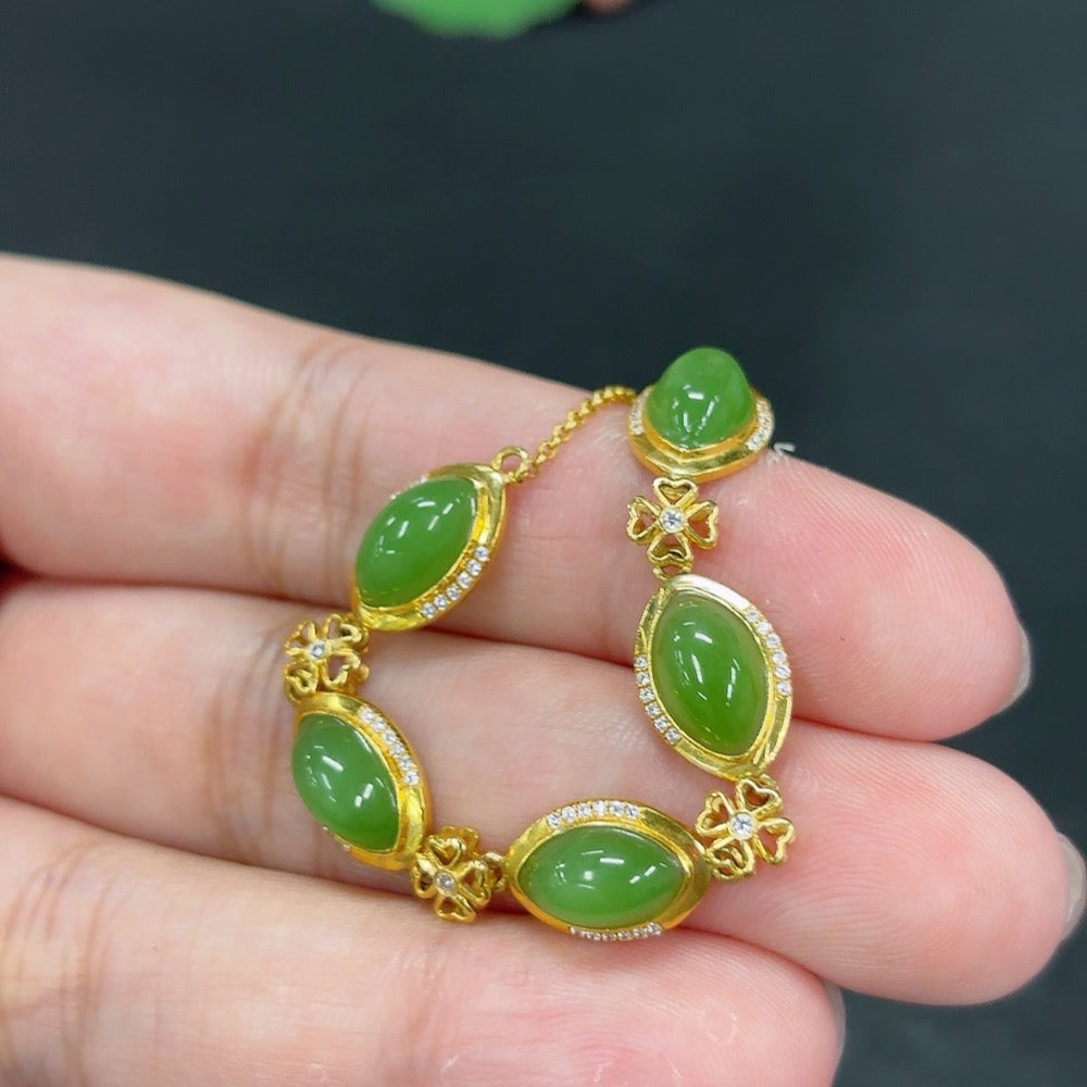 Hetian Jade Jasper inlaid bracelet by HKHQ with 18k gold, weighs approximately 4.3g, featuring a smooth, polished design.