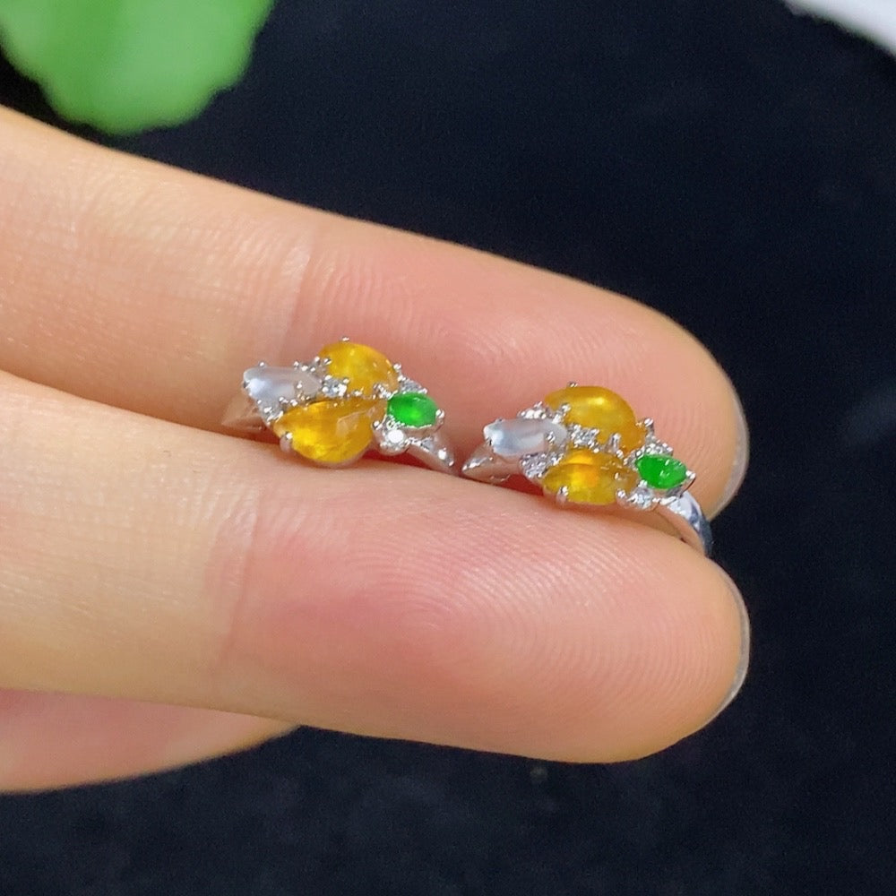Jadeite ear clips with 18k gold and diamond accents, total weight approximately 2.18 grams