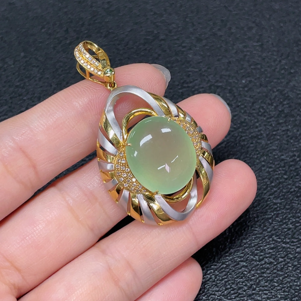 Prehnite pendant necklace with 18K gold and diamond accents, featuring a polished gemstone and delicate chain.