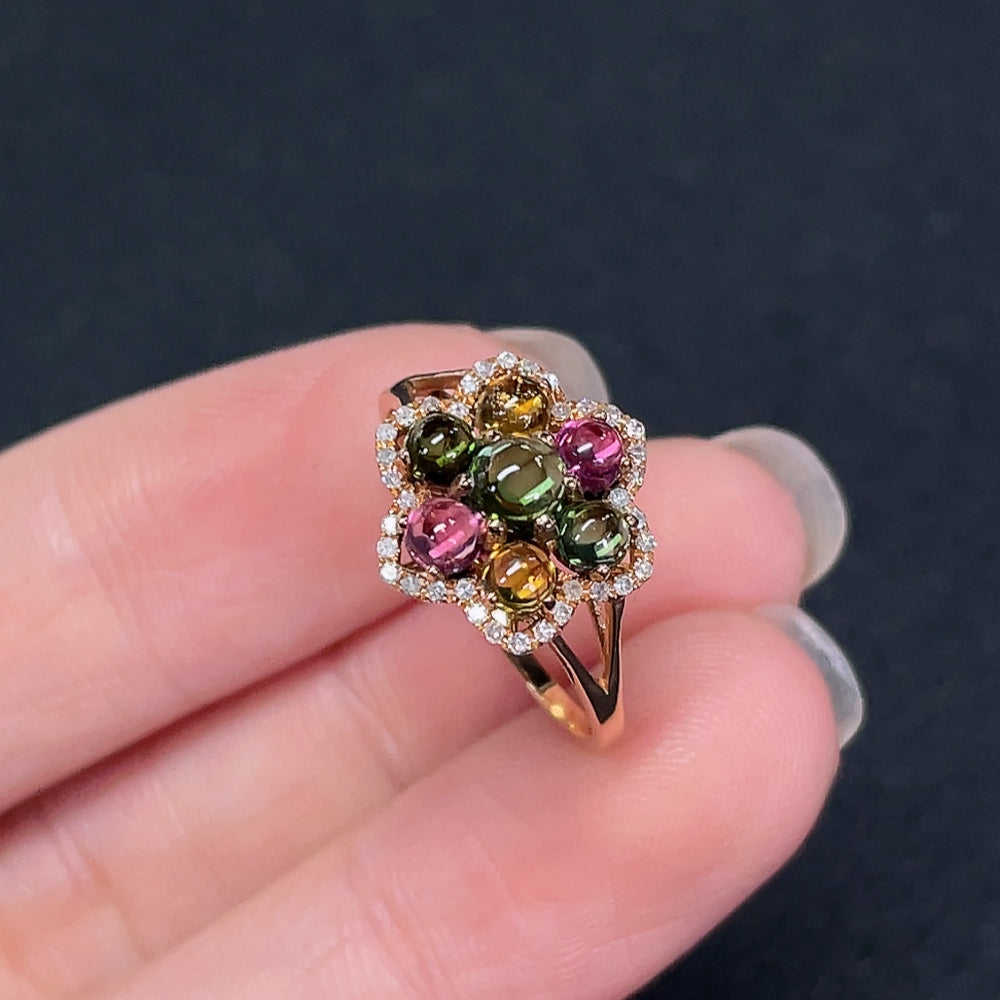 18K gold ring with inlaid tourmaline and diamond accents, elegant jewelry piece from HKHQ with detailed gemstone design.