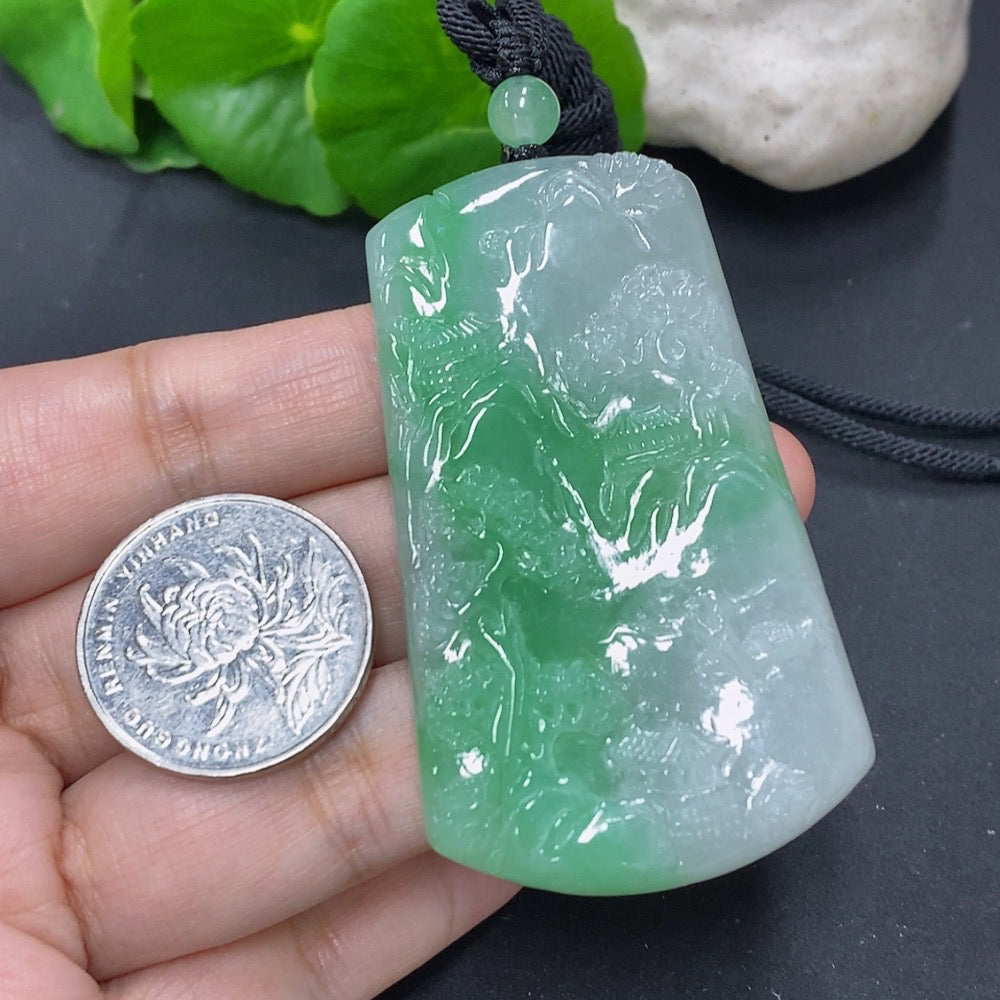 Jadeite pendant with landscape plaque design from HKHQ, weighs approx. 36.4g, includes cord, featuring detailed jade craftsmanship.