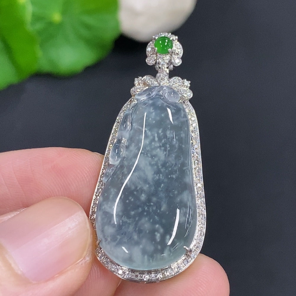 Jadeite auspicious gourd pendant with 18K gold accents and diamond details, featuring intricate carving and a polished finish.