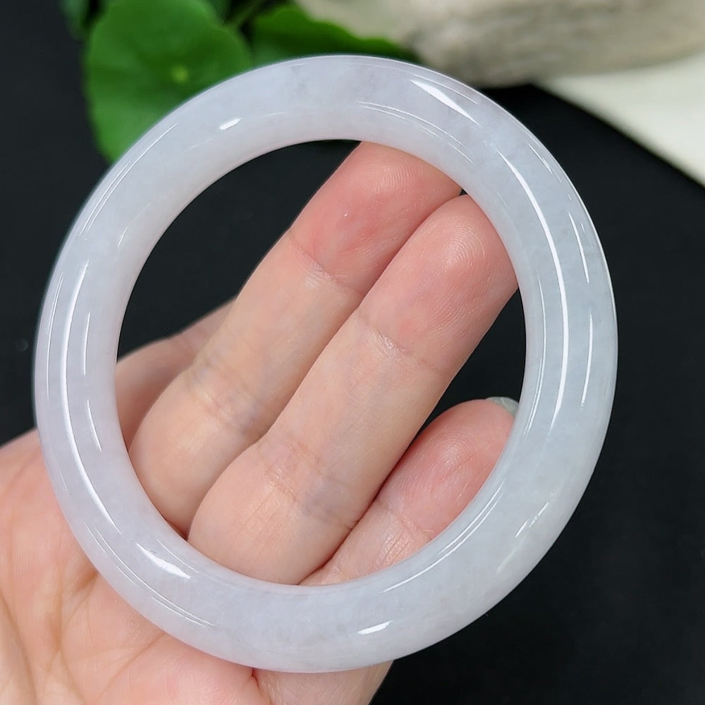 Jadeite round bangle in size 55, weighing approximately 53.33g, featuring smooth green jadeite with polished finish.
