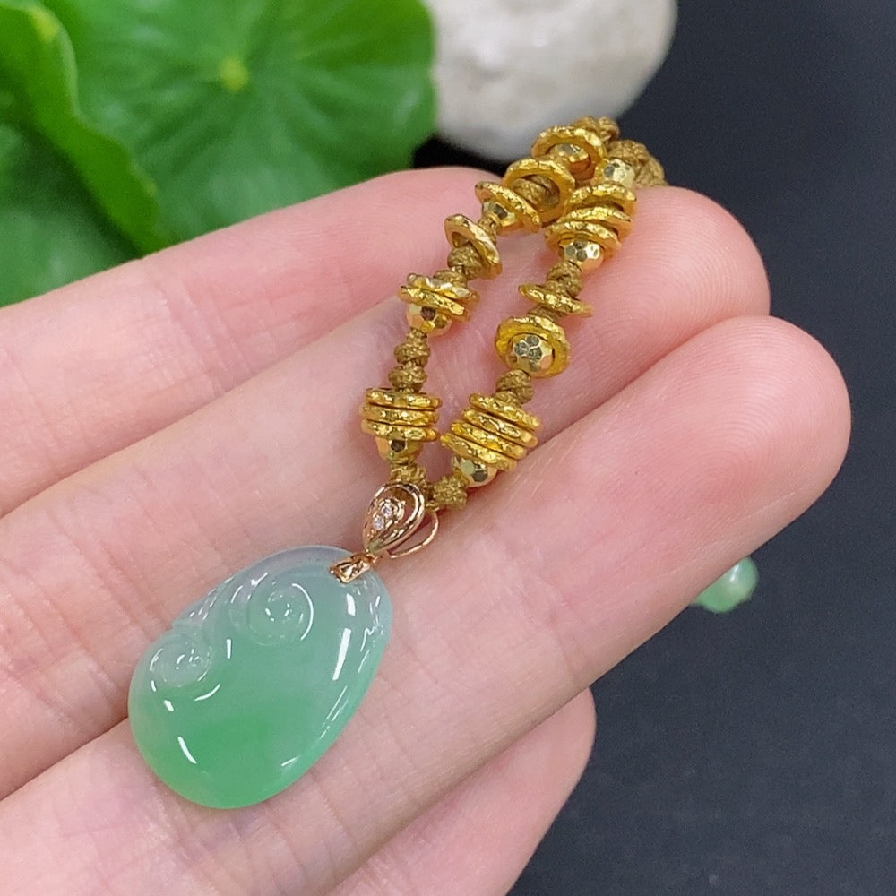 Jadeite Ruyi pendant with 18K gold and diamond accents, featuring a smooth jade surface and intricate design, on a cord.