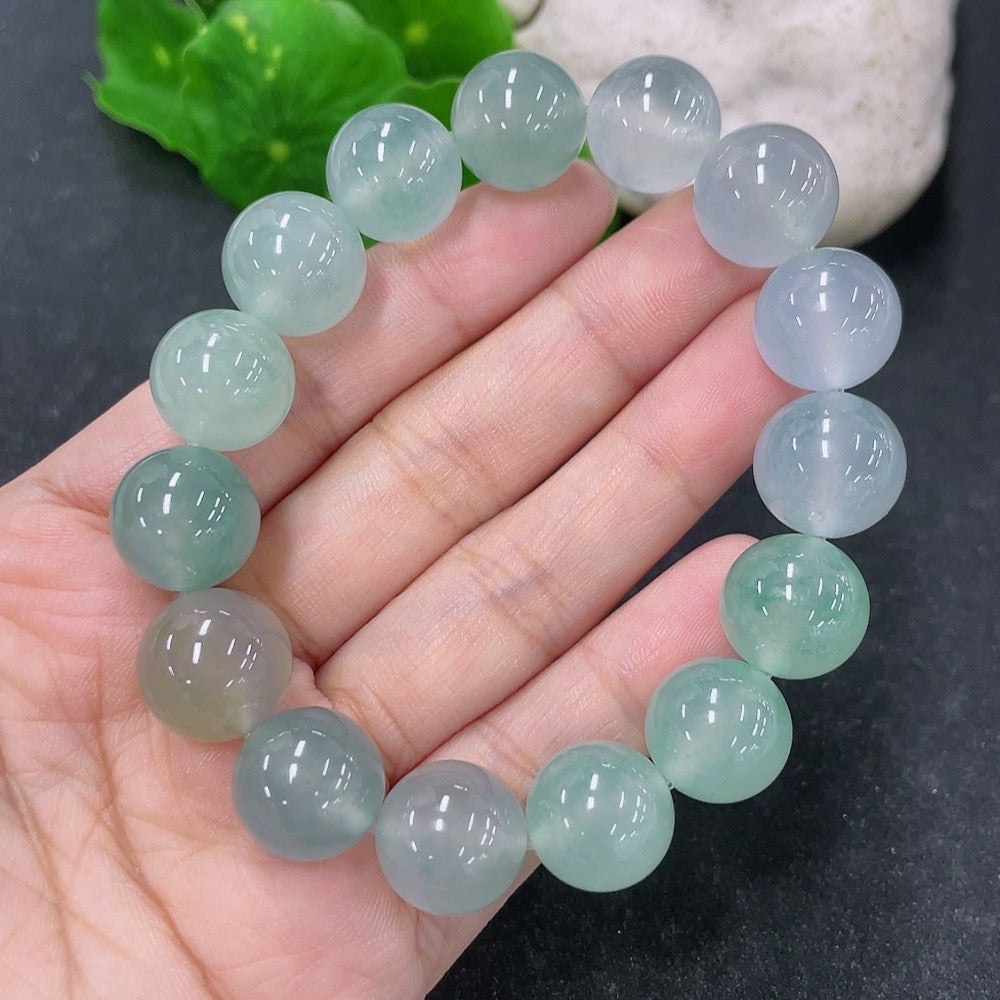HKHQ jadeite bracelet with 13.4mm beads, weighing approximately 56.13g, showcasing smooth, polished jadeite stones.