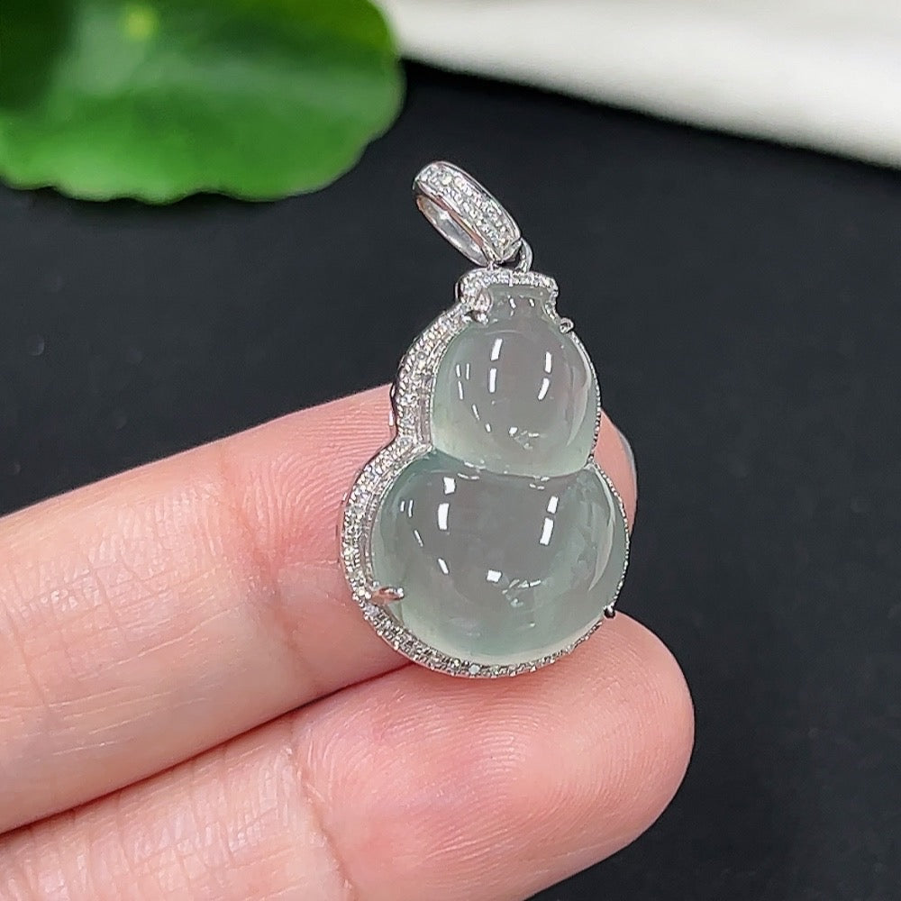 Jadeite gourd inlaid pendant on a necklace with diamond accents, crafted in 9k gold, weighing approximately 4.78g.