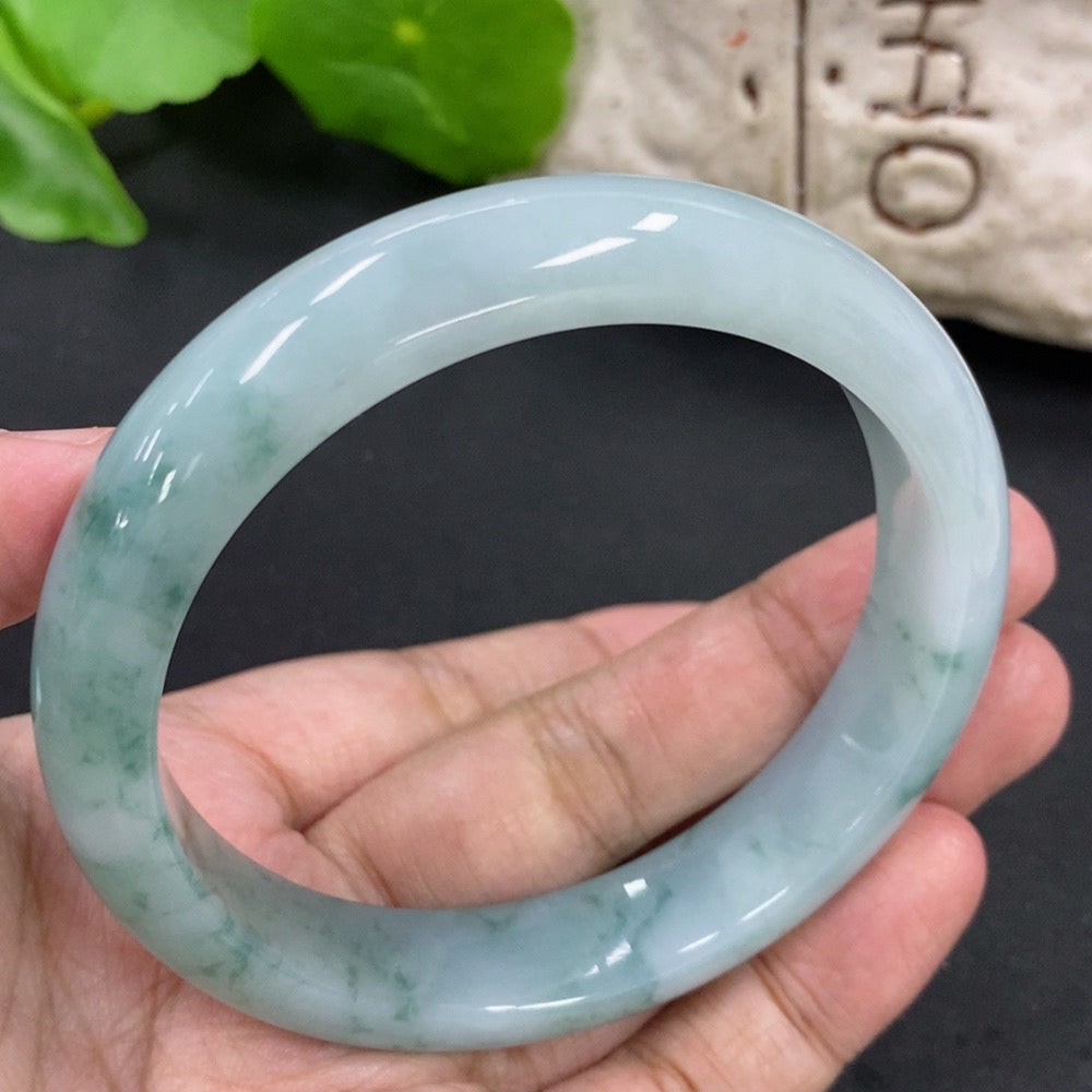 Jadeite round bangle with a 59.2mm diameter and 57.62g weight, crafted by HKHQ, showcasing smooth, polished green jade surface.