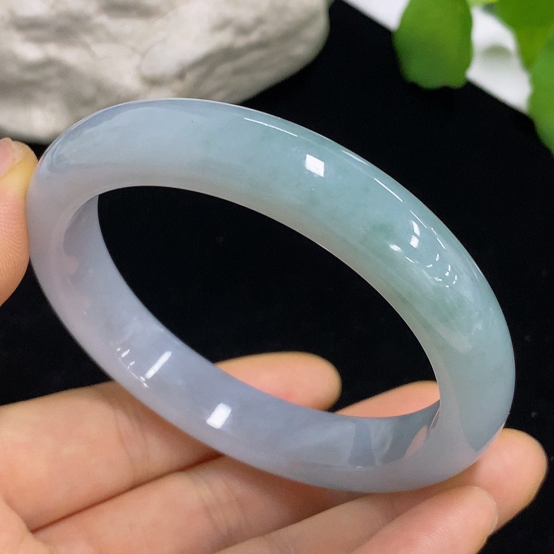 HKHQ jadeite round bangle in size 57.5 with a total weight of 57.64g, showcasing smooth, polished jade surface and rounded shape.