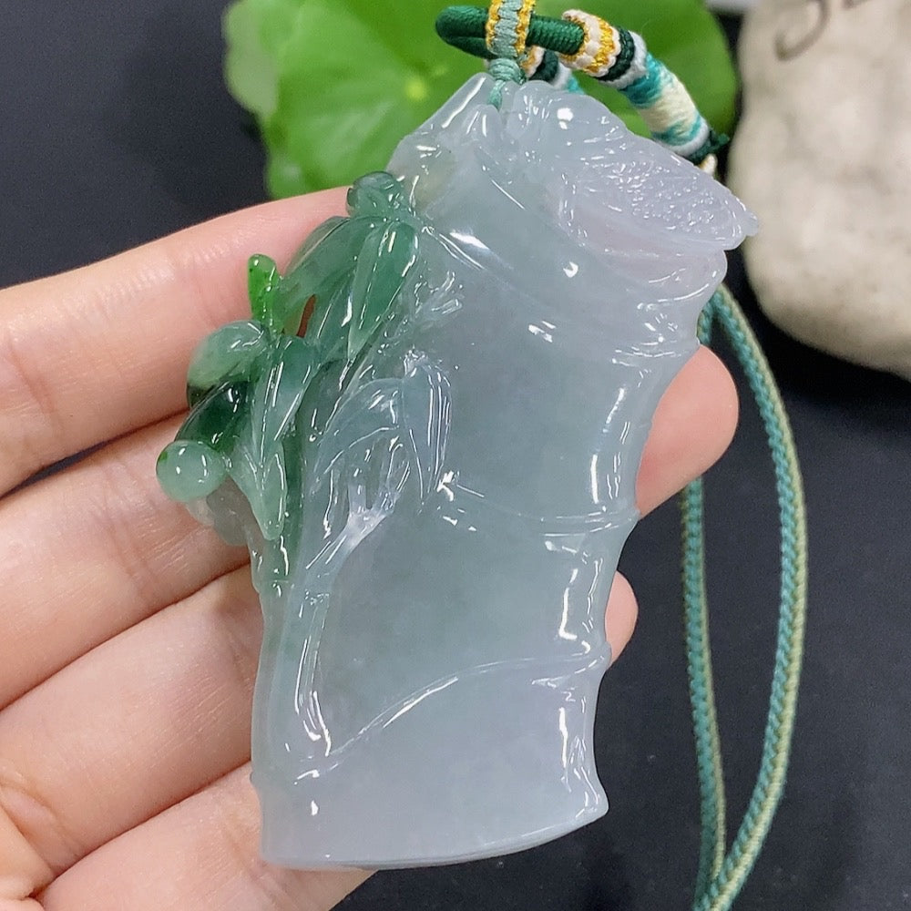 Jadeite bamboo pendant with mineral accents from HKHQ, featuring green jade and natural mineral components.