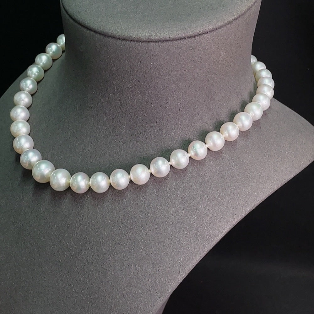 Elegant saltwater pearl necklace with a 14K gold strand from HKHQ, showing lustrous pearls arranged in a classic strand.
