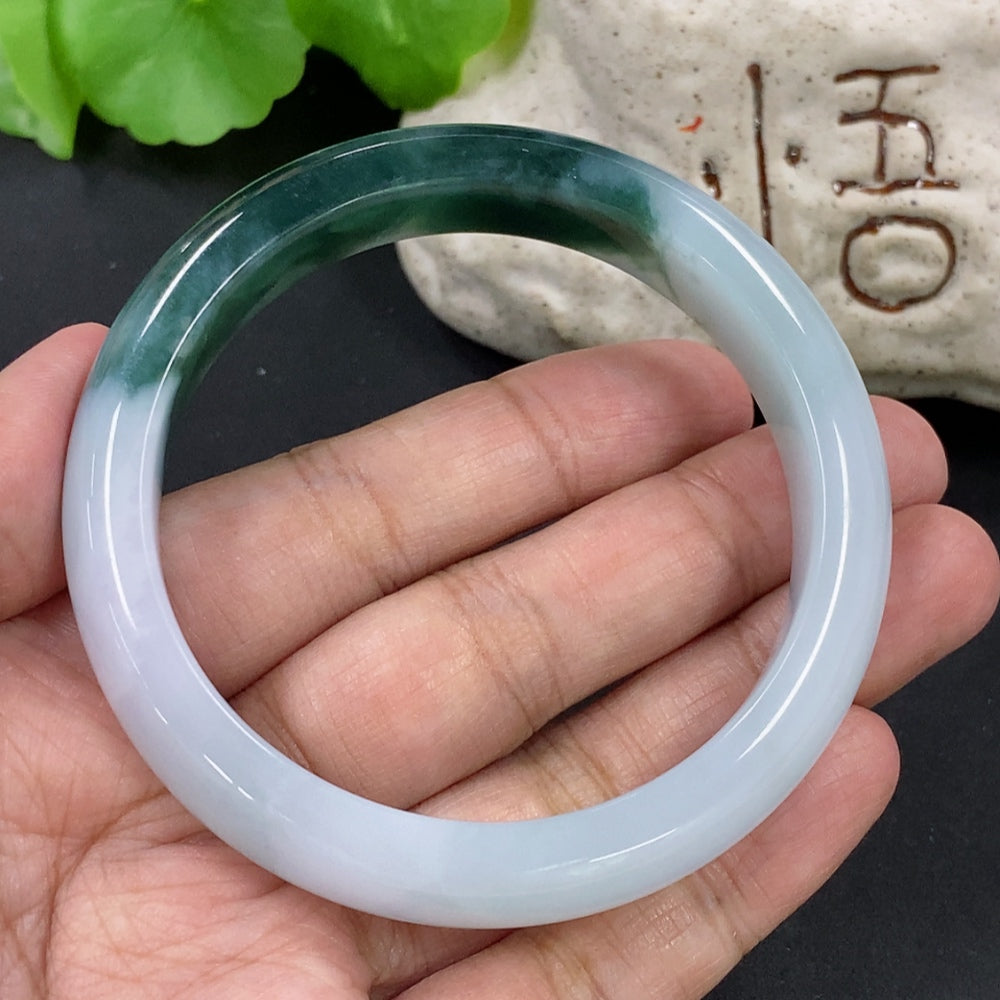 HKHQ jadeite round bangle, 51.68g, size 55.5, showcasing smooth jadeite surface and polished finish.