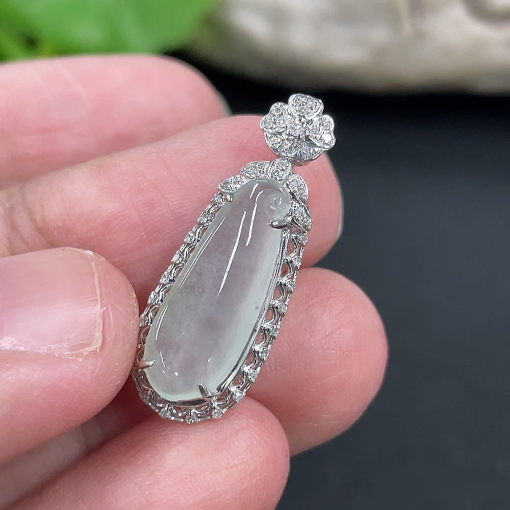 Jadeite blessing melon pendant in 18K gold with diamond accents, displayed against a neutral background.