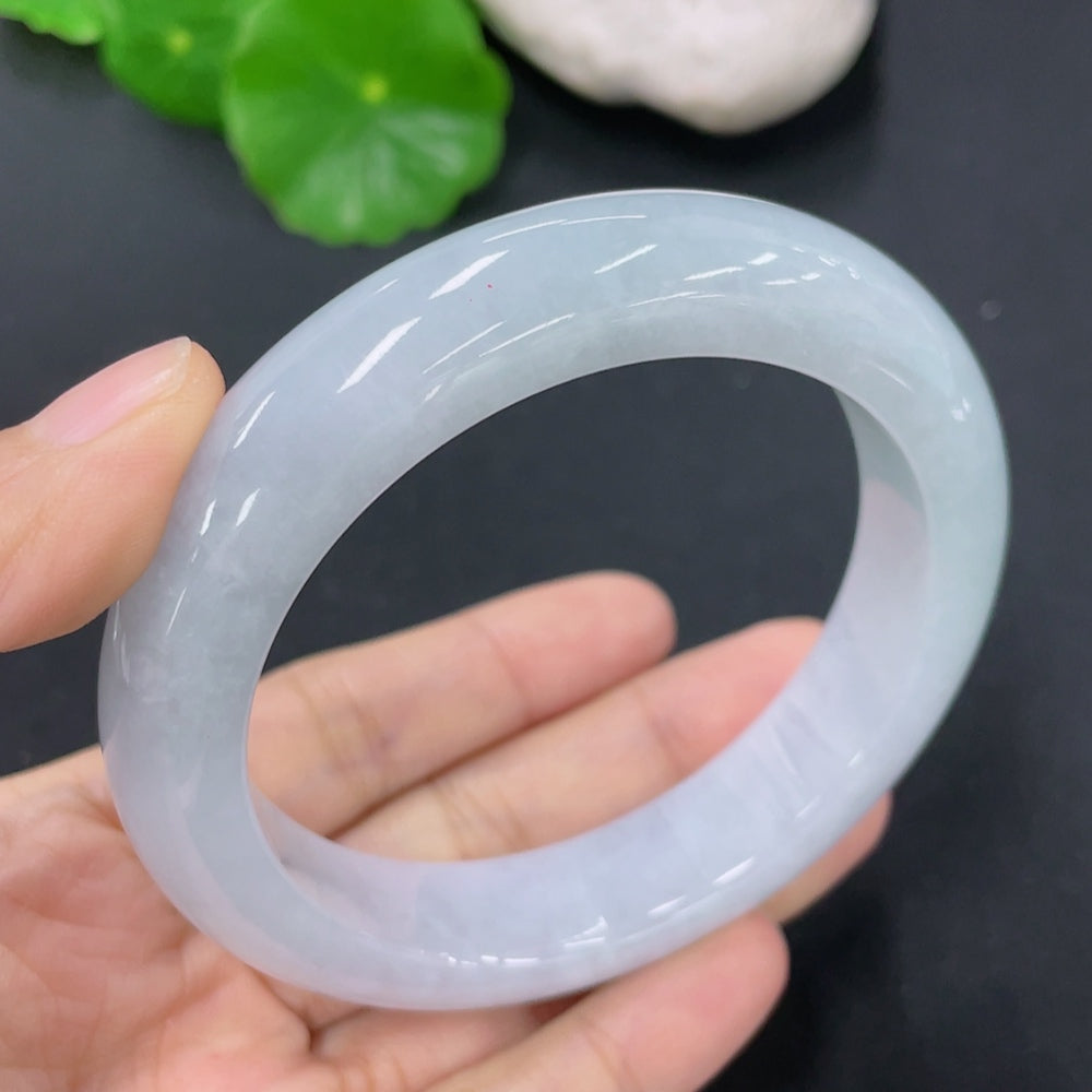 HKHQ jadeite round bangle in size 56.7, featuring smooth polished surface and natural green jade color.