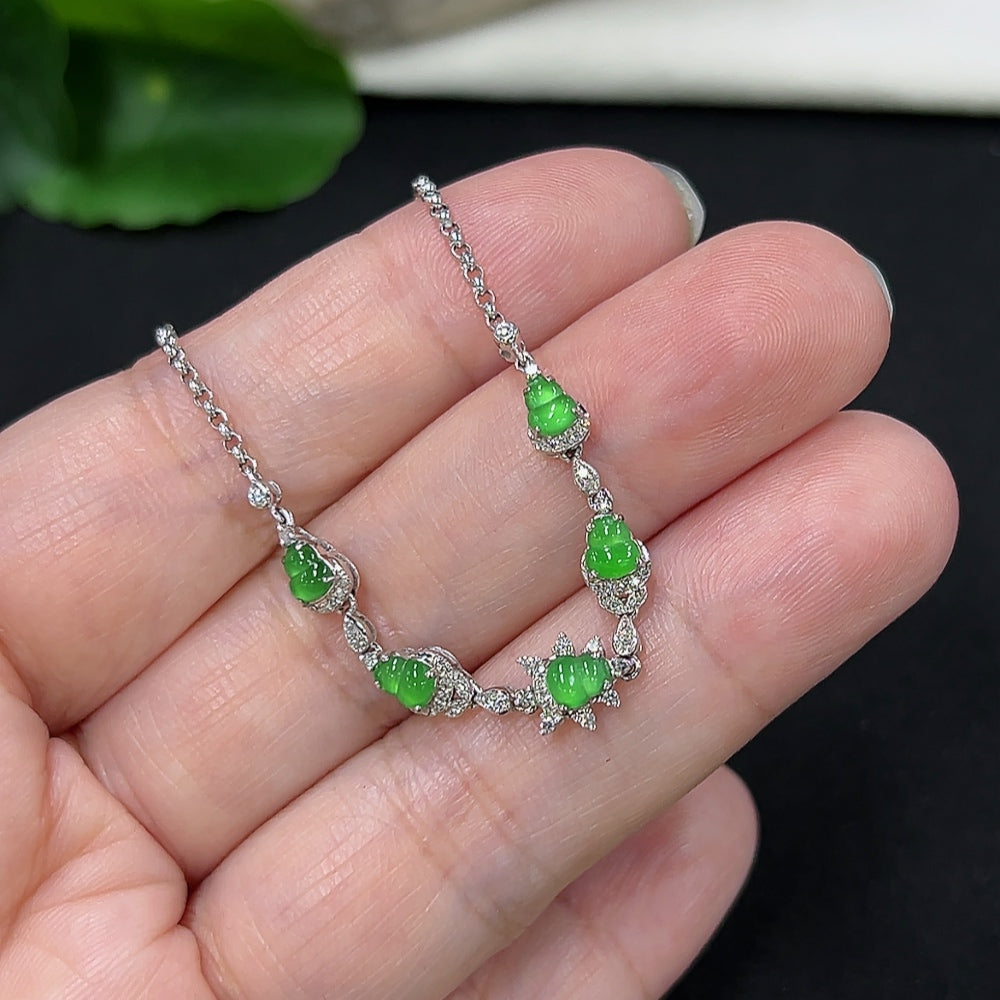 Jadeite gourd inlaid bracelet by HKHQ with 18k gold and diamond accents, featuring intricate design and polished finish.