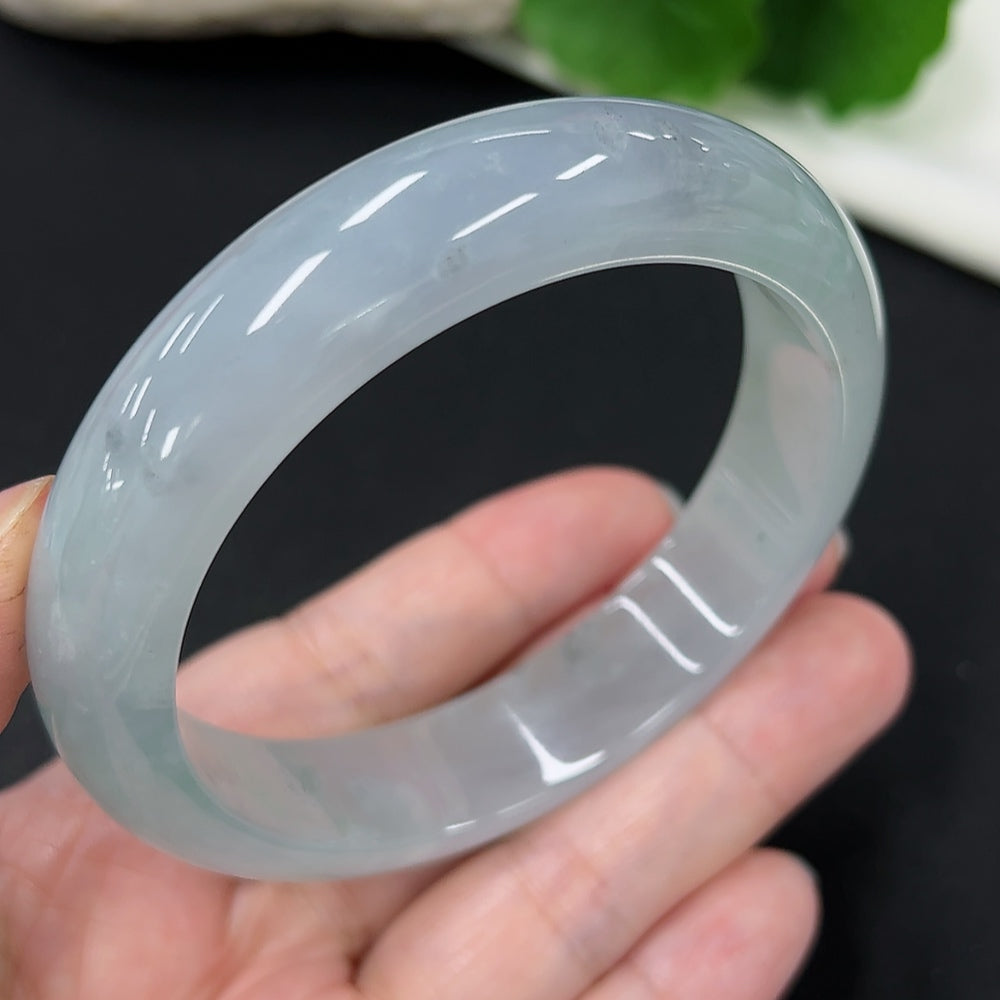 Jadeite round bangle with size 59.1 and weight 65.8g, crafted from high-quality jade, displayed on a plain background.