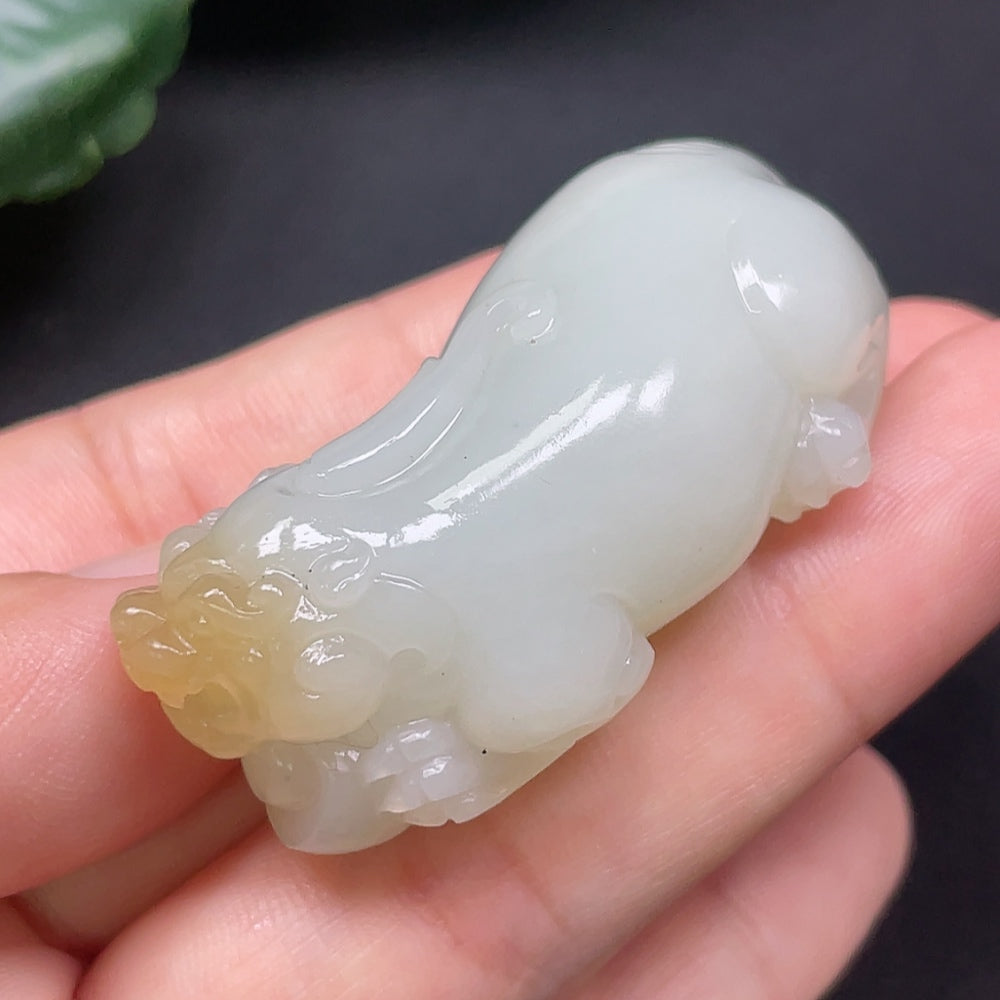 Hetian jade Pixiu pendant with detailed carving, weighing approximately 73.49g, crafted by HKHQ.