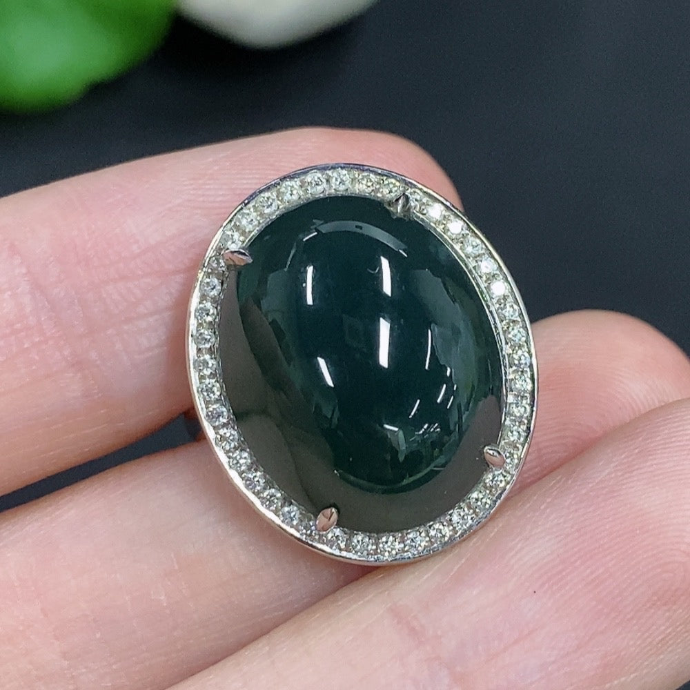 Jadeite cabochon ring with diamond accents, 18k gold, size 14, HKHQ, elegant jewelry with a polished jade green stone.