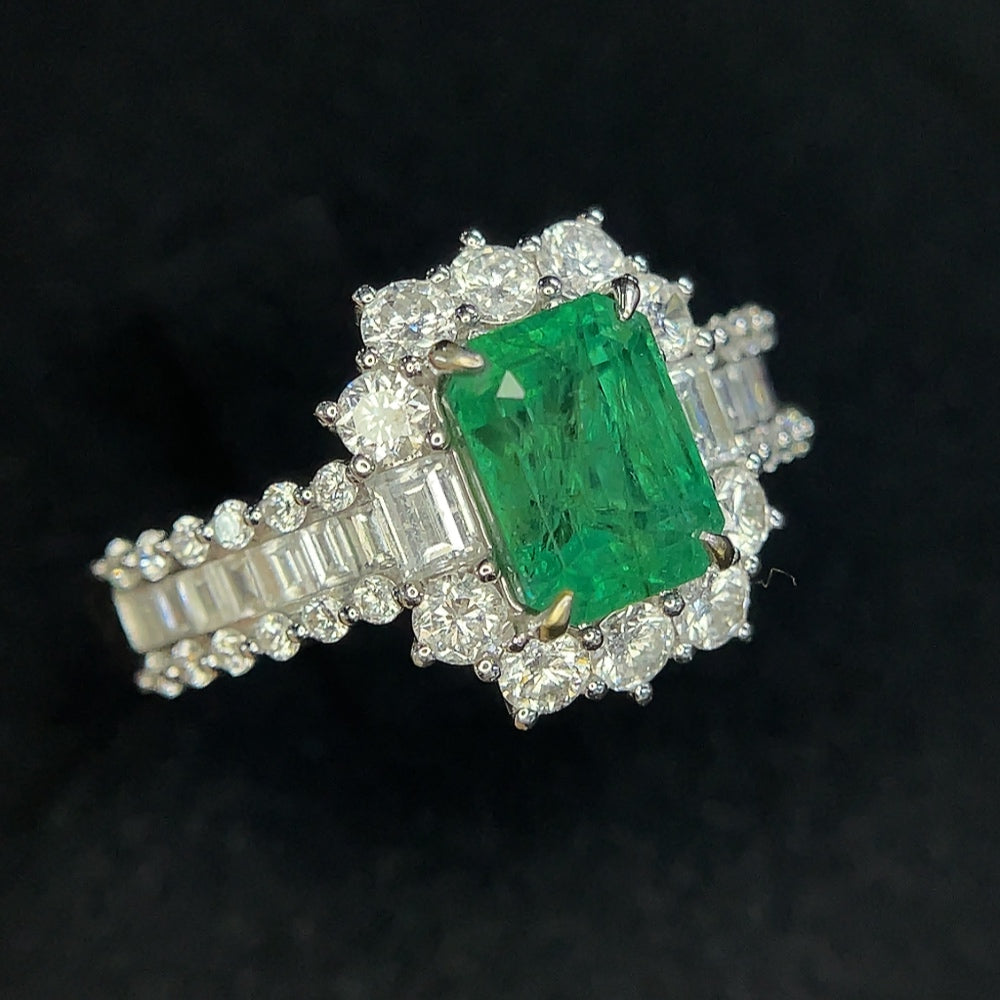 HKHQ emerald ring in 18K gold with clarity enhancement, size 19.5, showing the detailed gold band and vibrant emerald gemstone.